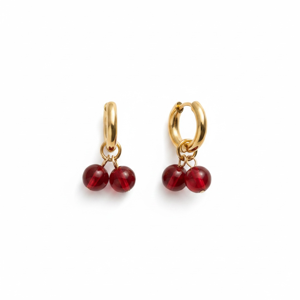 Gold huggie earrings with red cherry charms